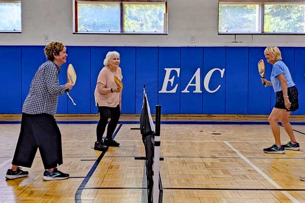Women playing pickle ball on the indoor courts at Ellis Athletic Center